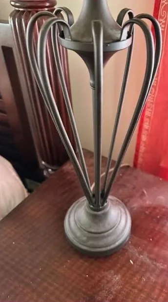 Dusty nightstand and lamp before cleaning