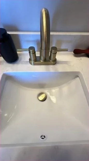 Bathroom sink shining after cleaning