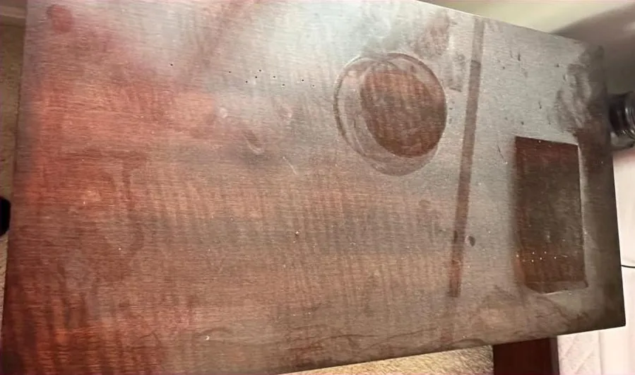 Wood table covered in dust and stains before cleaning